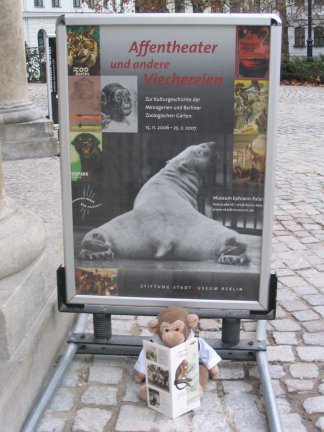 Jimby under a poster for the Monkey Theatre