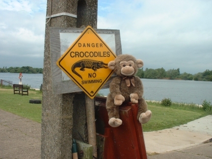 Jimby with a crocodile warning sign at Swarkestone Sailing Club