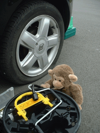 Jimby fixing a flat tyre