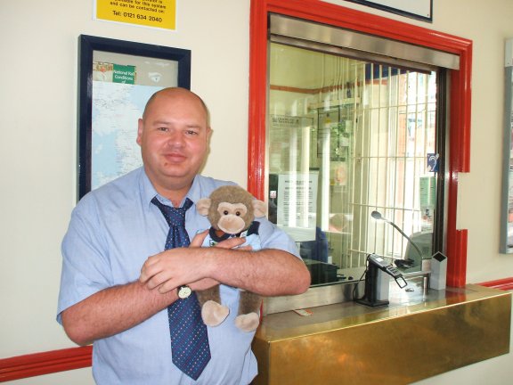 The Ticket Office Clerk makes  a fuss of Jimby